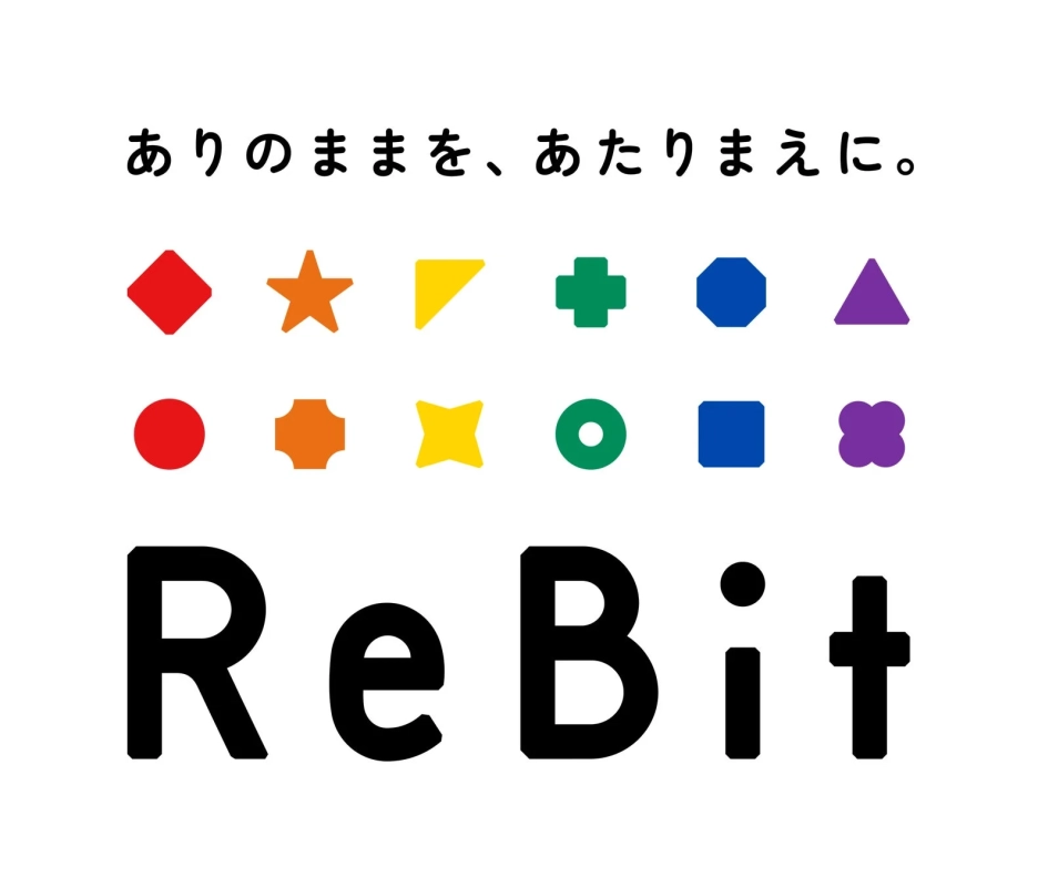 カラフルな多様な図形が並び、多様性と受容を表現