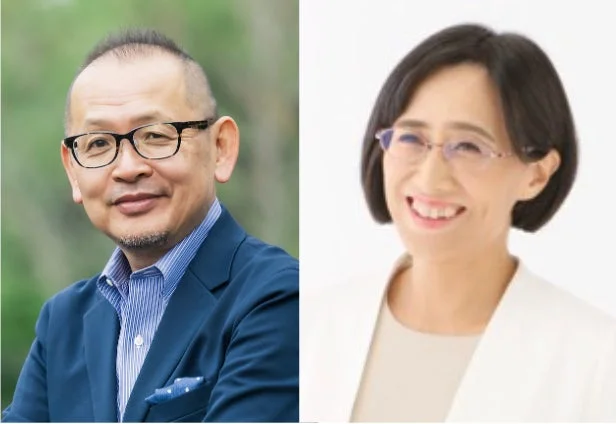 メガネをかけた笑顔の男性と女性が並んで写っているポートレート写真です。男性はスーツ姿で、女性はジャケットを着用しています。