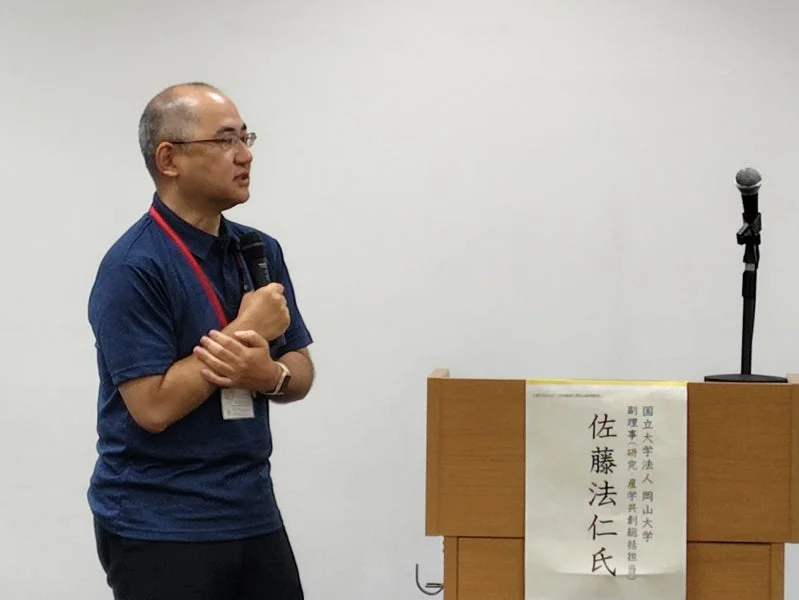 講演する佐藤法仁副理事